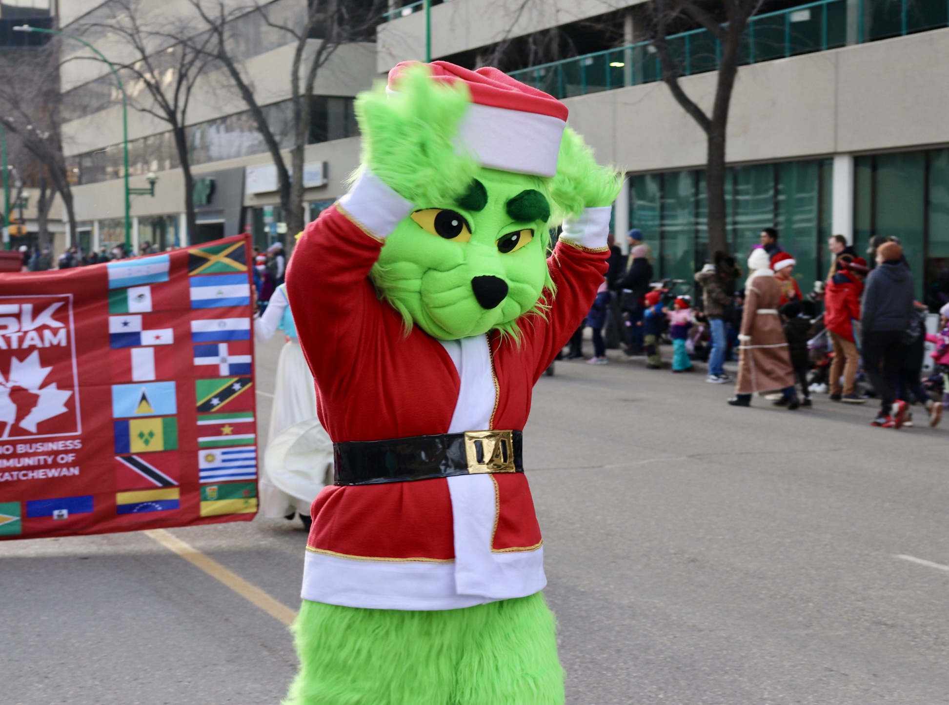 Green Christmas character appearance for holiday events in Edmonton